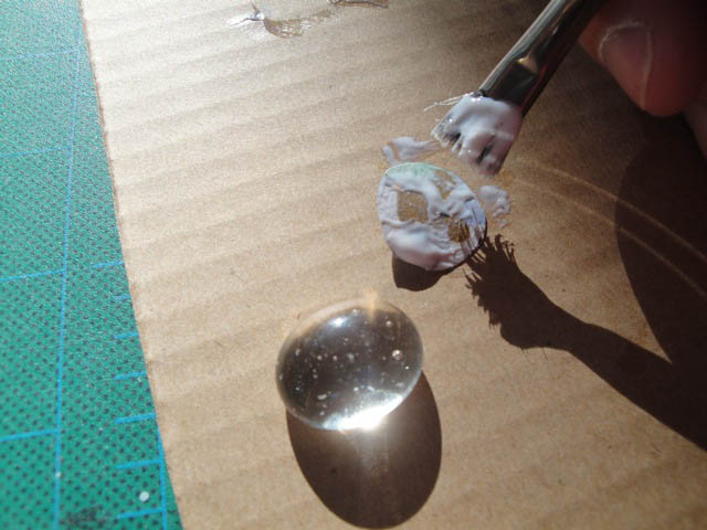 paint mod podge onto glass beads