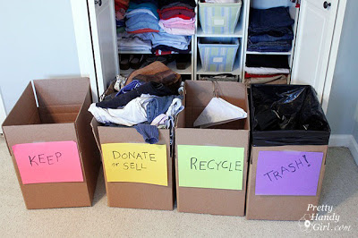 cardboard boxes in front of closet labeled keep, donate/sell, recycle, trash