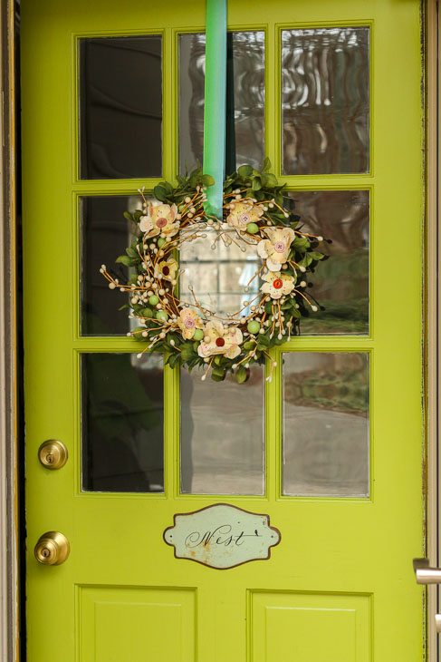 chartreuse green door with spring wreath