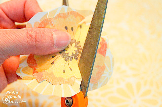 cut slits into both scrapbook flower layers