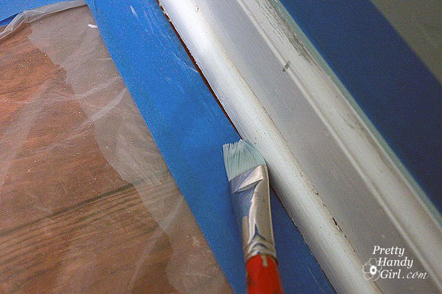 room with painting tape and paint brush
