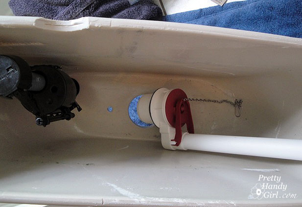 insert_bottom_of_flushvalve Toilet Repairs Replacing the Overflow Tube and Flapper