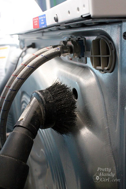 vacuum_back_of_dryer_washer Clean Your Dryer Ducts - Prevent Fires