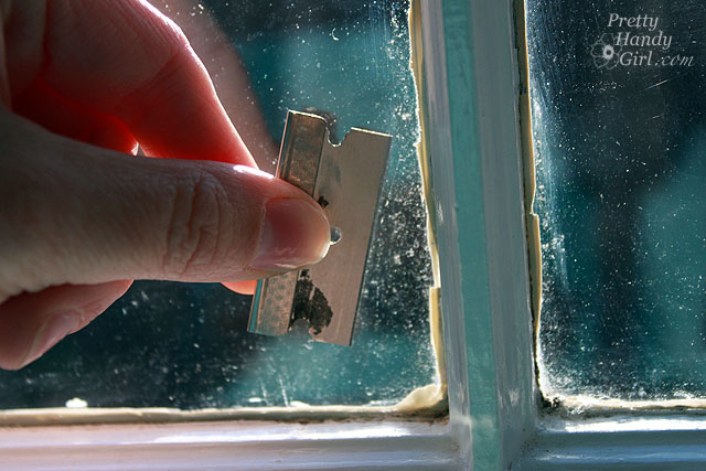 clean_window_with_razor_blade