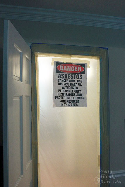 danger_asbestos_sign Sign on plastic covering a door saying Danger Asbestos cancer and lung disease hazard. Asbestos Removal - Everything You Wanted to Know and More