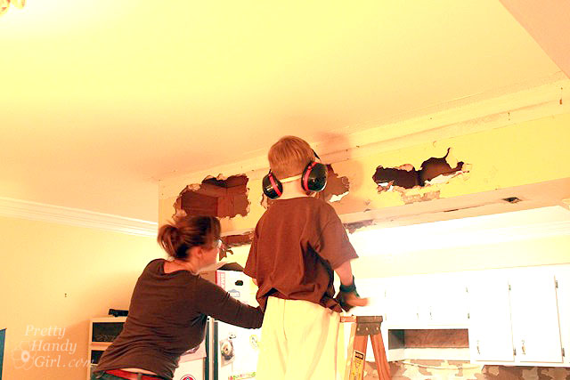 knocking_out_drywall How to Remove a Soffit - Kitchen Renovation Update