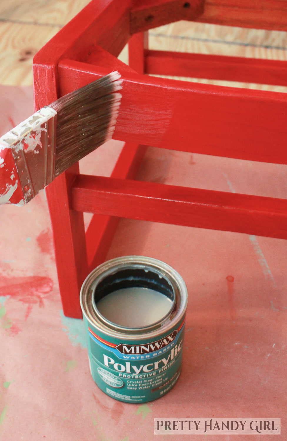 adding a top coat of polycrylic over the red painted chair frame
