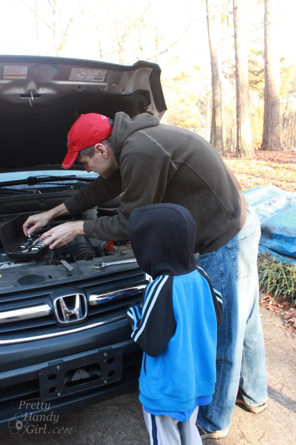 working_on_car_with_little_helper