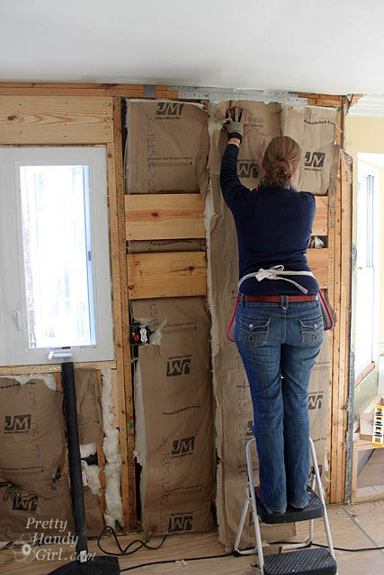 handy_girl_hanging_insulation