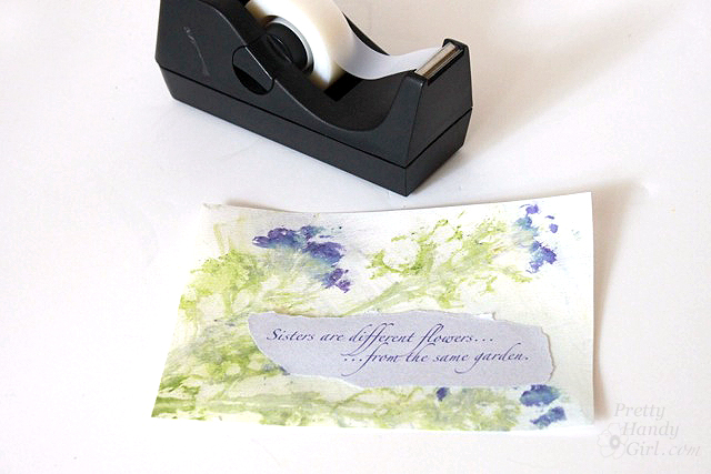 tape_phrase_onto_paper
