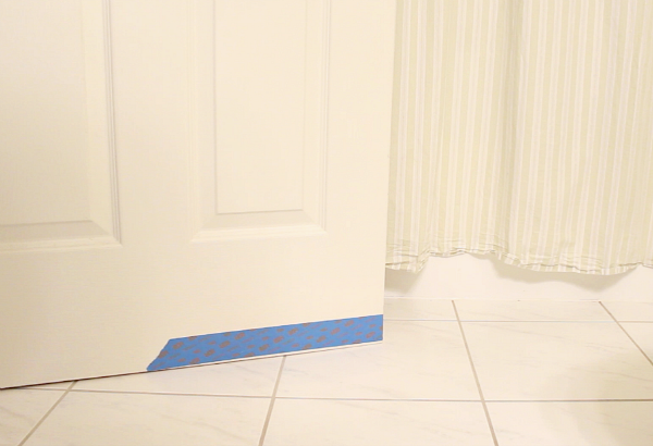 Place tape on door bottom