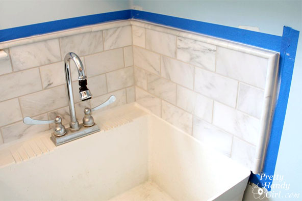 painters-tape-around-edges-for-caulking