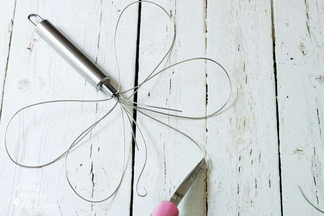 Dragonfly Garden Decor using a Dollar Store Whisk and Skewer | Pretty Handy Girl