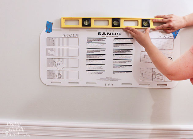 Installing a Wall Mount Flat Screen TV + Hiding Cords | PrettyHandyGirl
