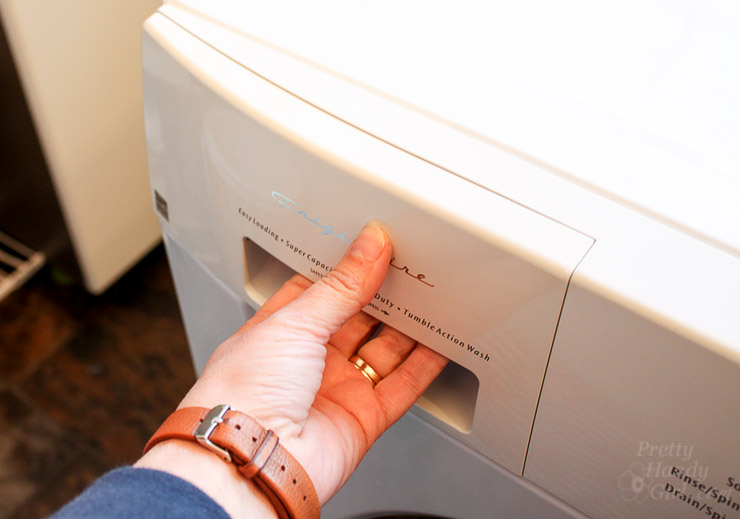 Pulling Out detergent drawer on clothes washer