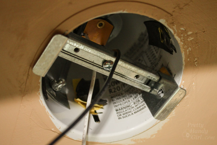place-fixture-brace-into-can-fixture