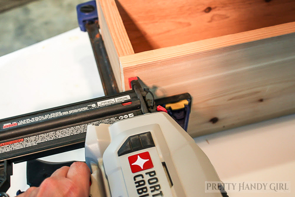 clamp window box pieces and nail the front and back to the sides