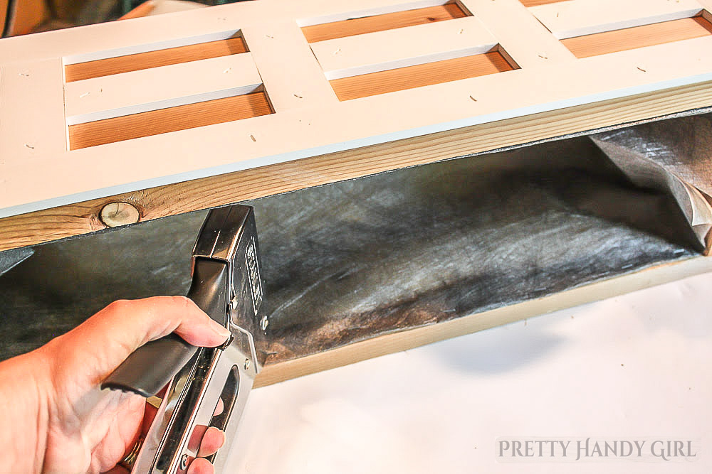 staple weed block fabric inside window box to retain soil