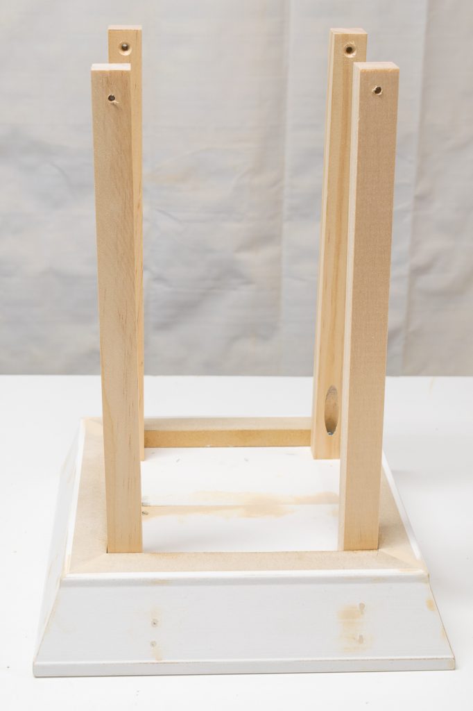 Attach the pillars to the base of the candle lantern with 1 1/4" pocket hole screws.