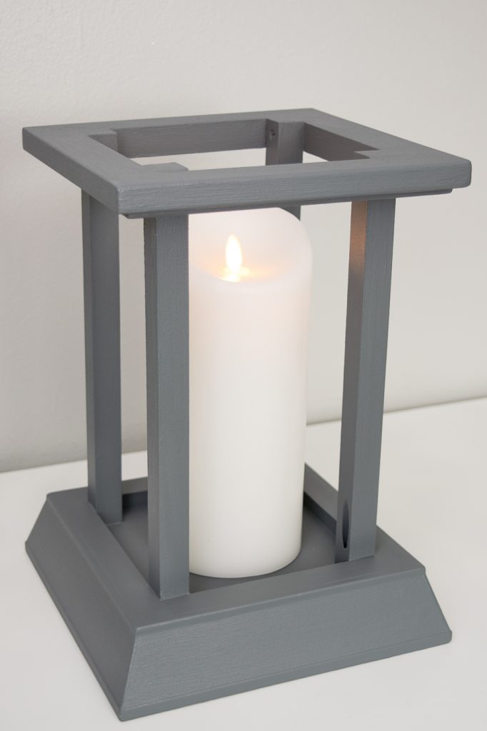 This candle lantern is easy to make using leftover trim from my fireplace makeover!