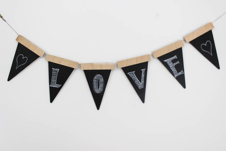 Love this twist on the traditional party banners! This rustic wooden version can be used again and again.