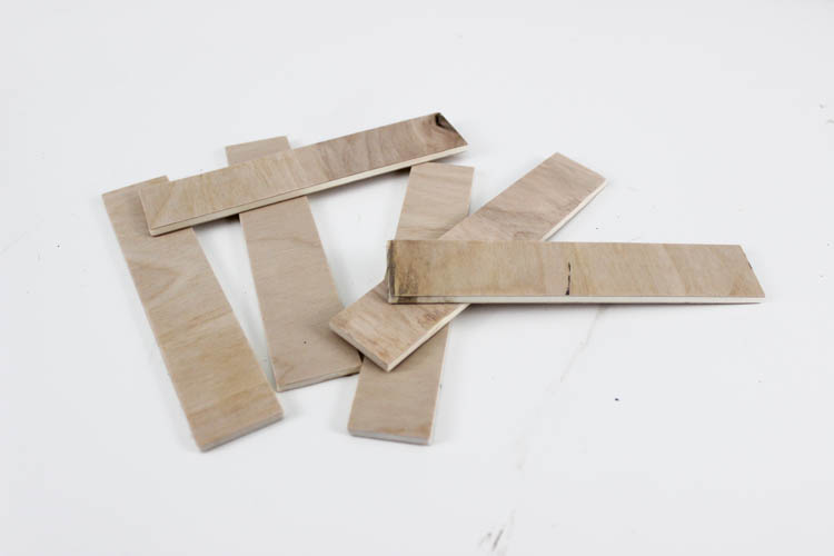 Love this twist on the traditional party banners! This rustic wooden version can be used again and again.