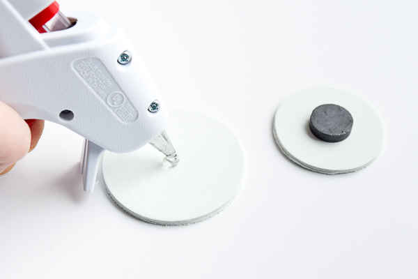 Add magnets to the back of your curtain tie backs with hot glue.