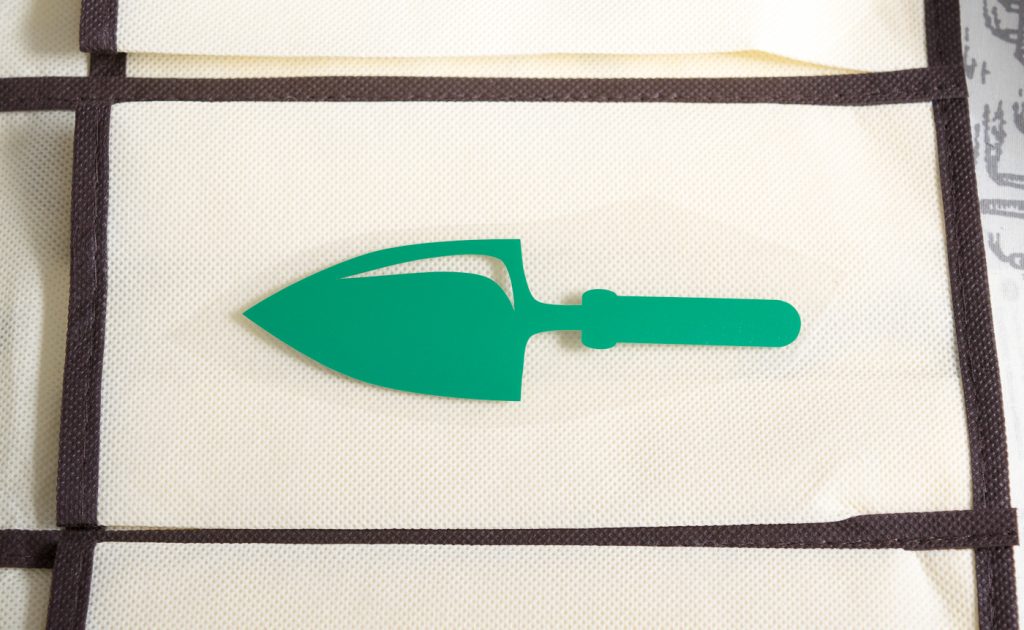 When using iron-on vinyl, make sure to apply it with the clear plastic side up.