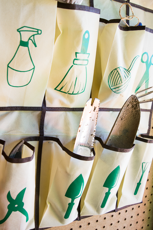 If the tools fall forward too much, staple the fold of the pocket to the wall to keep them straight.