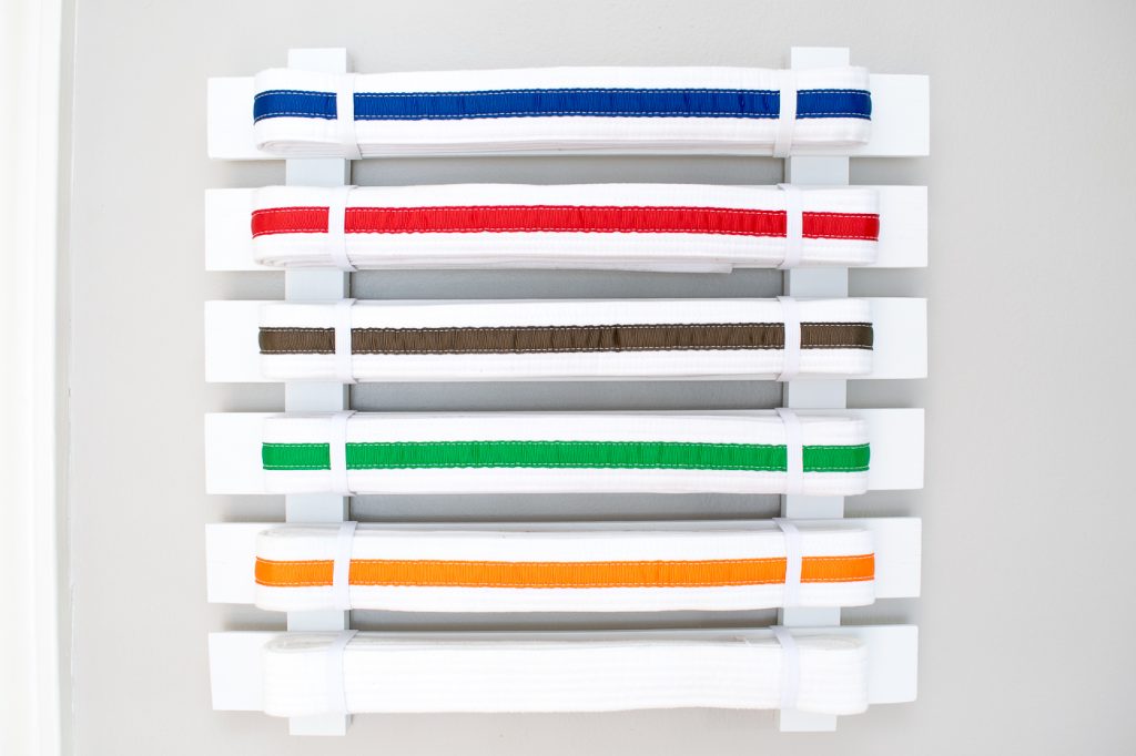 This simple karate belt display is easy to make and customize to any number of belts.
