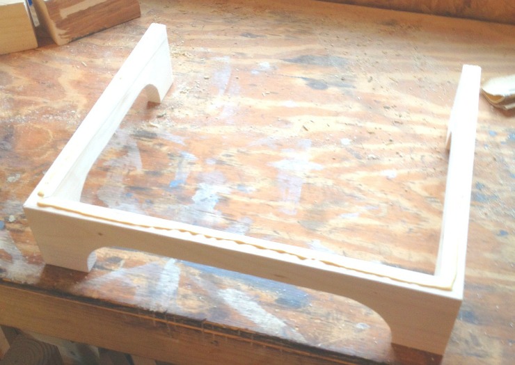 Add glue along edges of leg assembly