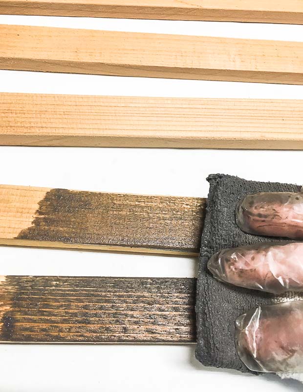 Stain the cut pieces of your fence trellis before assembly.