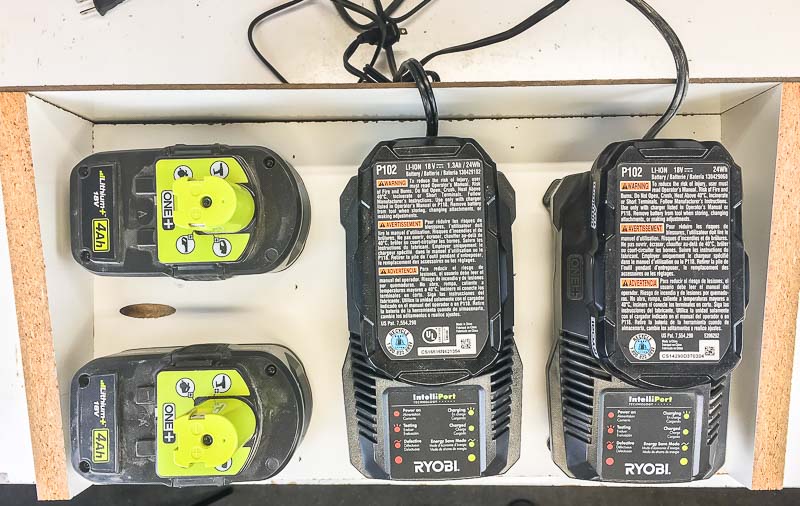 The top of the cordless drill storage box fits two chargers and two extra batteries.