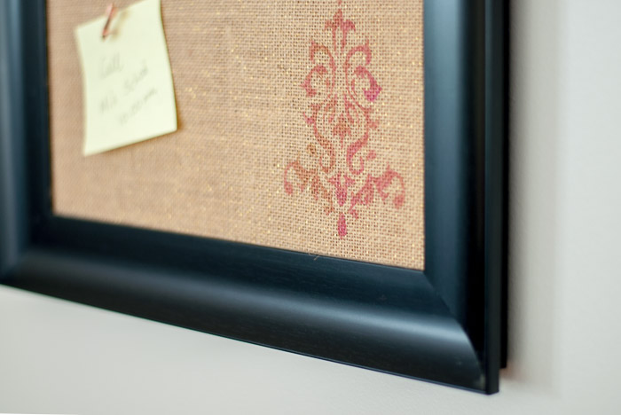 Adding stencils on burlap covered bulletin board