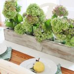 Green and purple hydrangeas in rustic wood trough. Build Your own Rustic Trough Centerpiece tutorial.