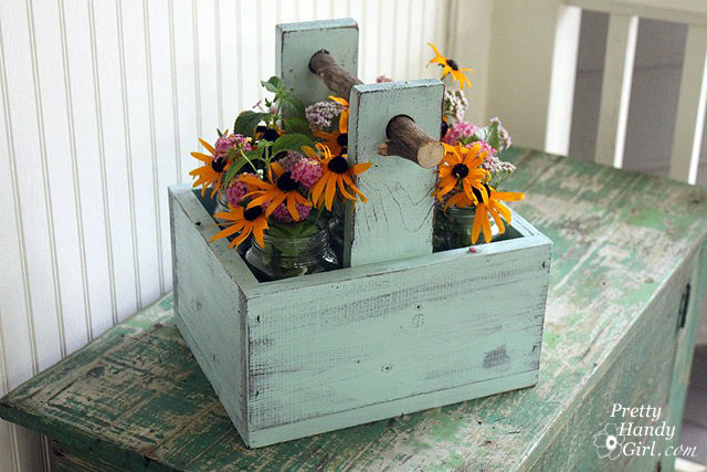 rustic wooden caddy with branch handle