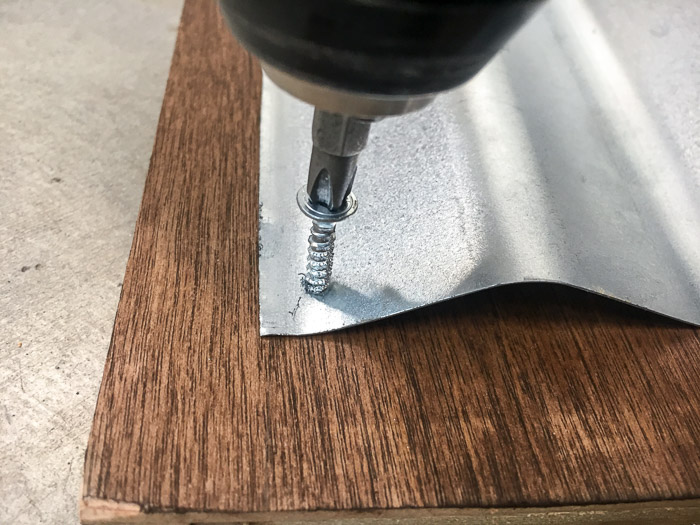 How to attach metal to wood