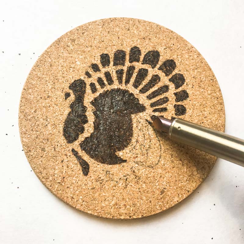 Outline the edge of larger areas with the tip of the woodburning tool.