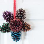 how to make a glittered pine cone door hanger