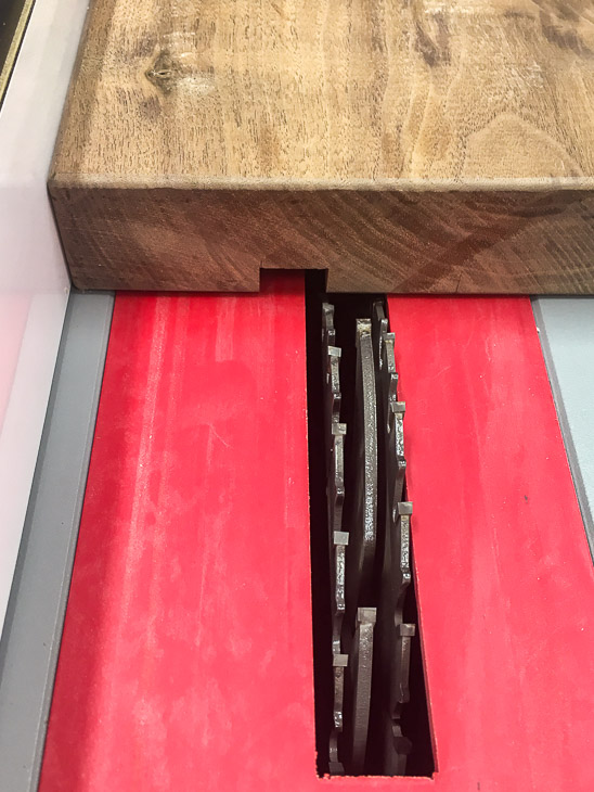 Cut the groove for the marble with a dado blade in the table saw.
