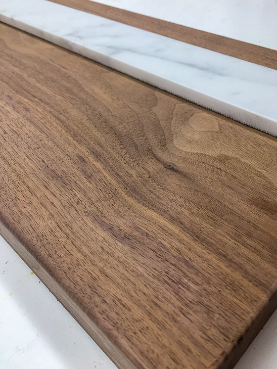 Determine the placement of the marble on the cheese board.