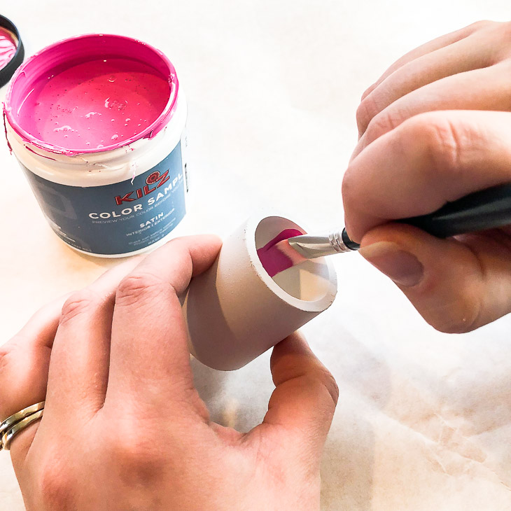 Carefully paint the inside of each pipe with bright pink paint.