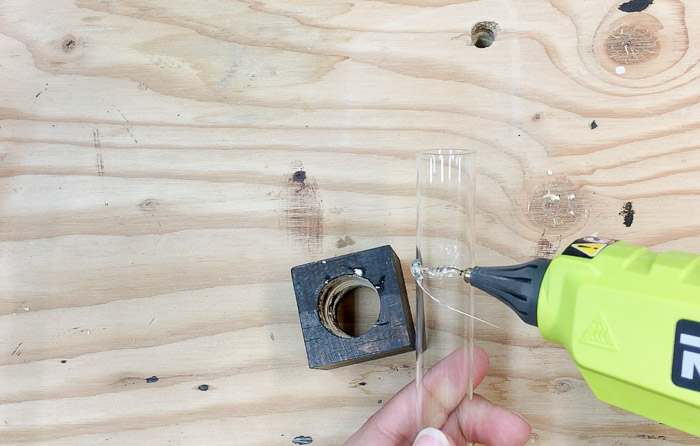 attaching the test tube to the vase