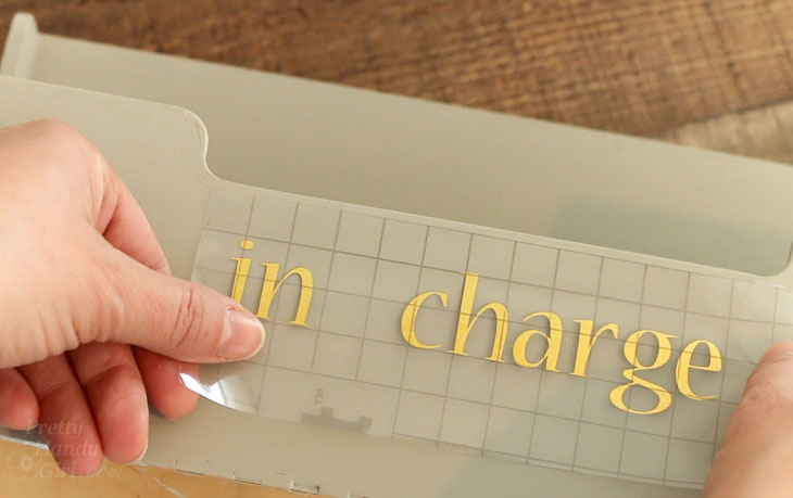 Add vinyl lettering "in charge"
