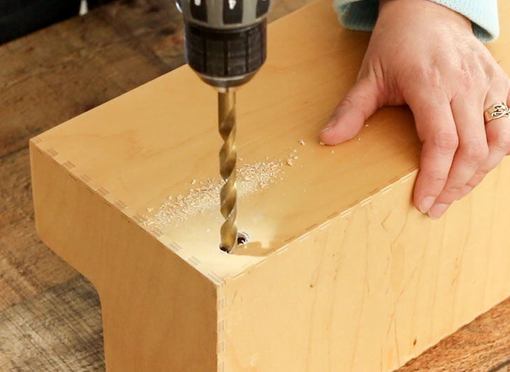 Drill through back of organizer for plug