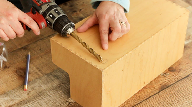 Choose drill bit the width of one of the plug holes.
