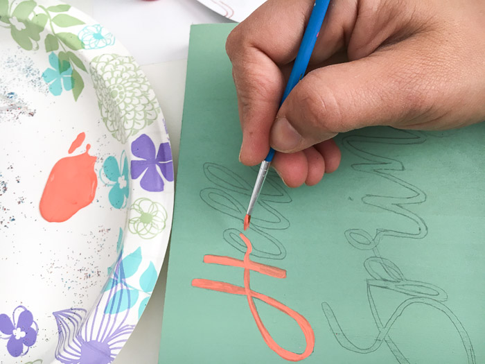 Painting a Hello spring sign