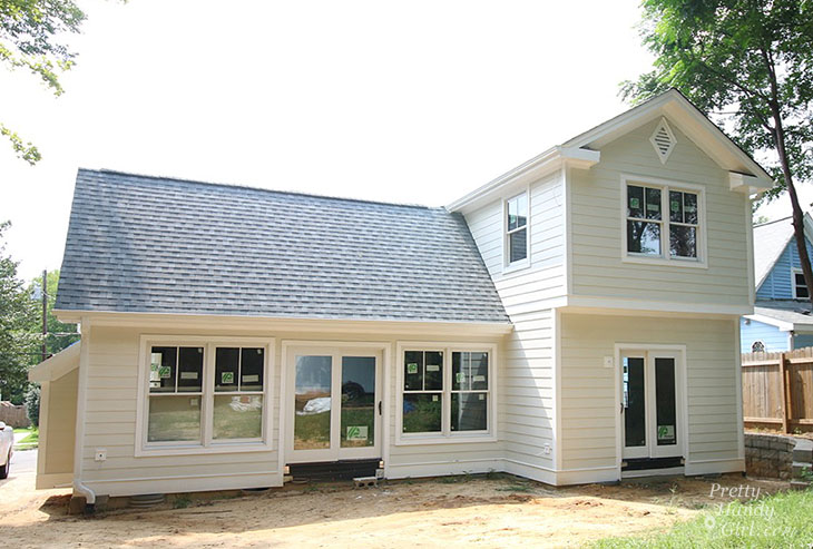Plygem Mira doors and windows on cream house
