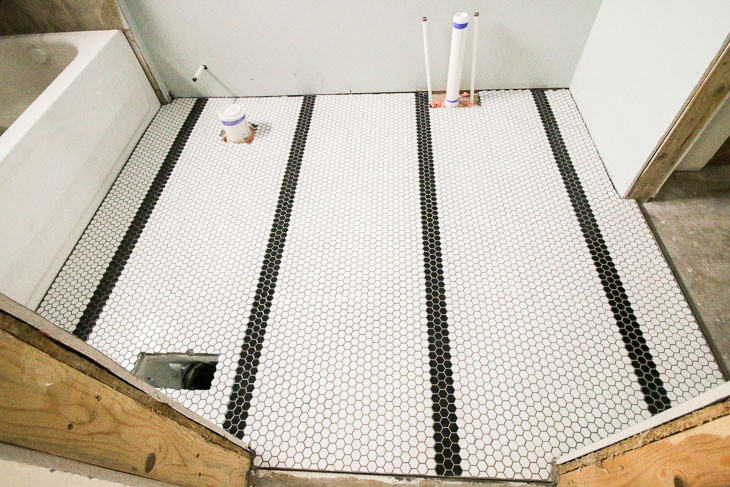 Jeffrey Court Small White and Black hex tiles in bathroom