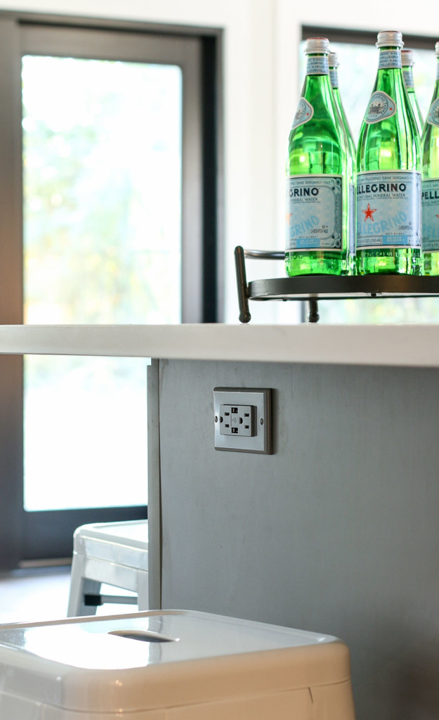 gray usb charging outlet in gray island cabinets